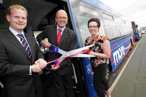 ALL ABOARD: Wilts and Dorset MD Andrew Wickham cuts the ribbon, with operations director Ed Wills, left, and commercial manager Nikki Honer
